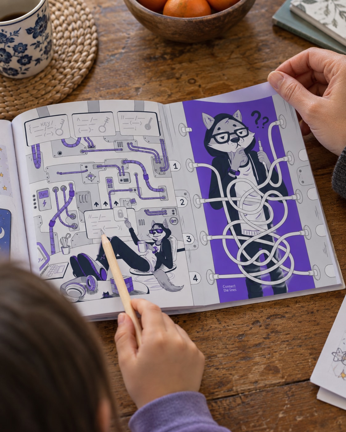 Hands turning an illustrated activity-book page during a family activity.