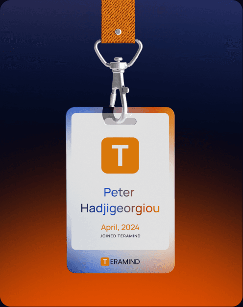 Teramind employee badge on an orange lanyard.